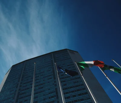 low-angle-view-flag-building-against-sky